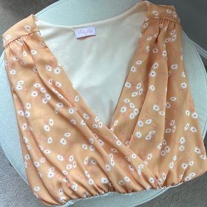 Pink Lily: Grand Salutations Peach Daisy Bodysuit